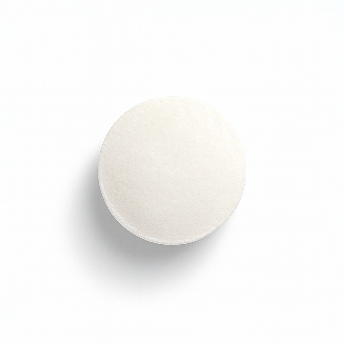 A single round white L-Carnitine tablet shown from above on a clean white background with a soft shadow.